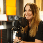 Marta Fabiánová, Managing Director at TCC online, is in the studio recording a podcast.