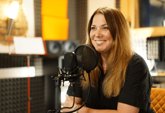 Marta Fabiánová, Managing Director at TCC online, is in the studio recording a podcast.